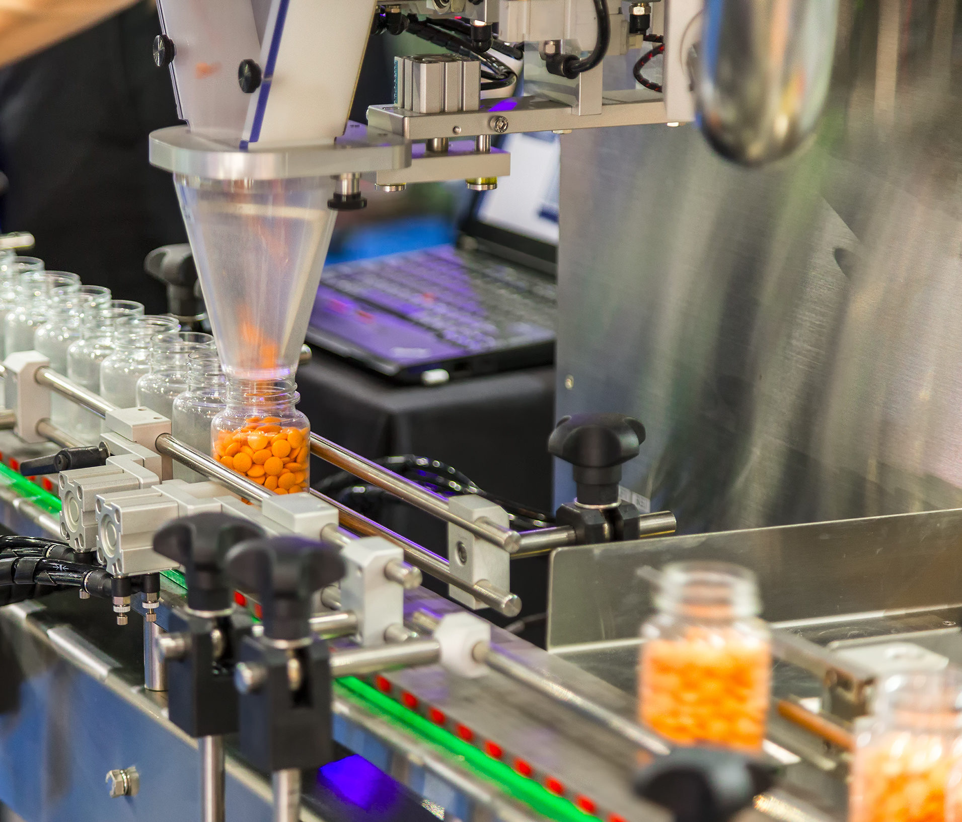 Tablet / Capsule counting machine conveyor in production line of pharmaceutical industry.